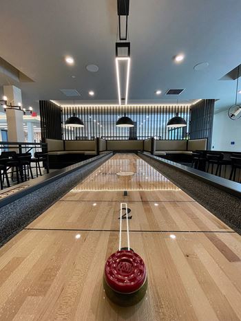 Recreation room w/ fireplace, lounge space  and banquet seating